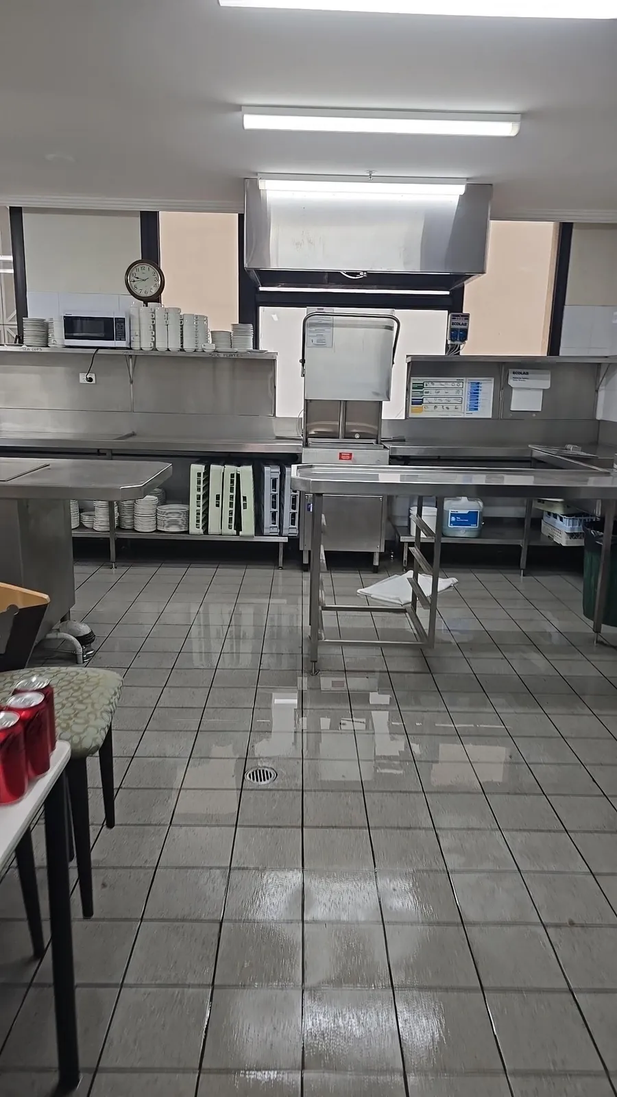 Water across the commercial kitchen floor.