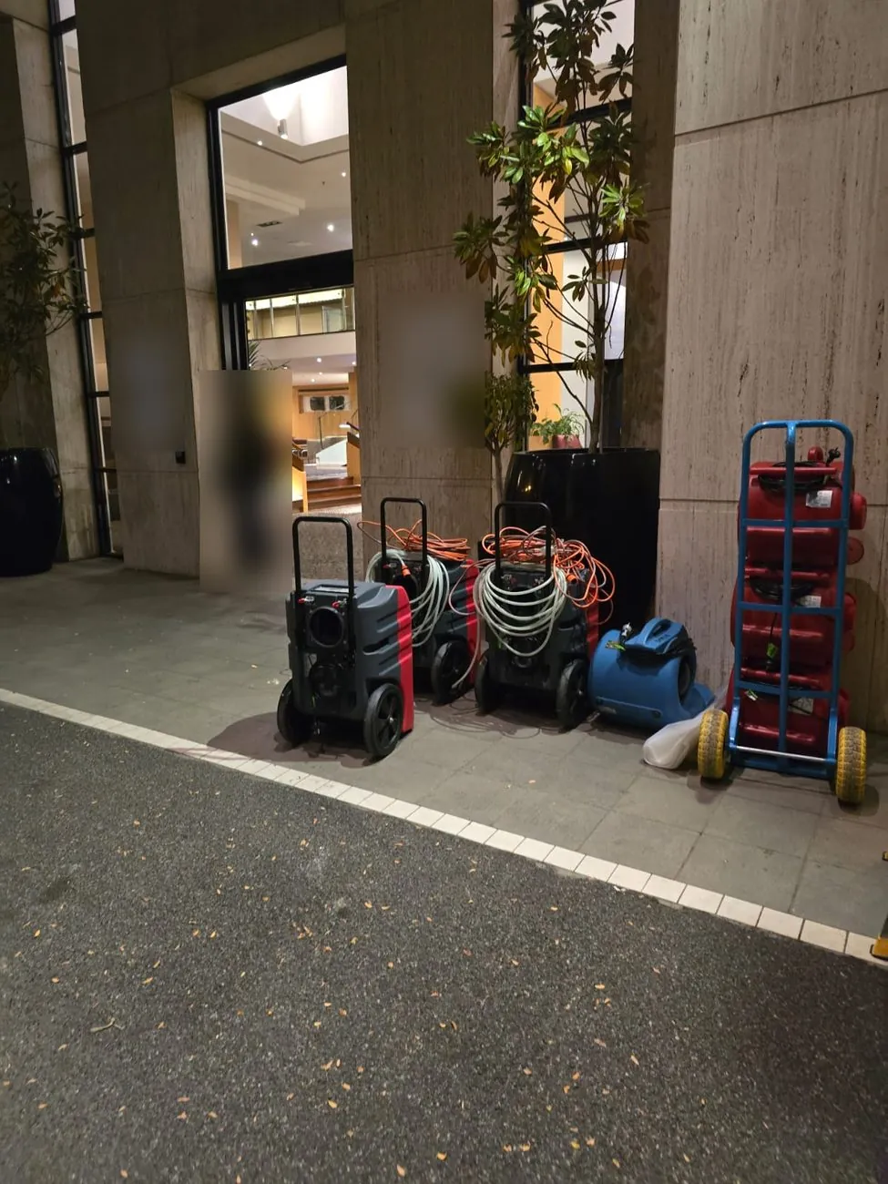 Drying equipment staged at the hotel entrance on the night of the call.