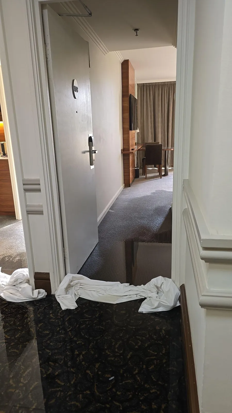 Towels laid at a guest room entry by hotel staff.