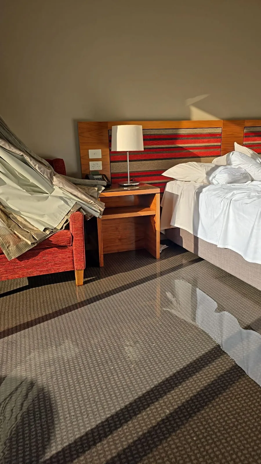 Standing water across a guest room floor.