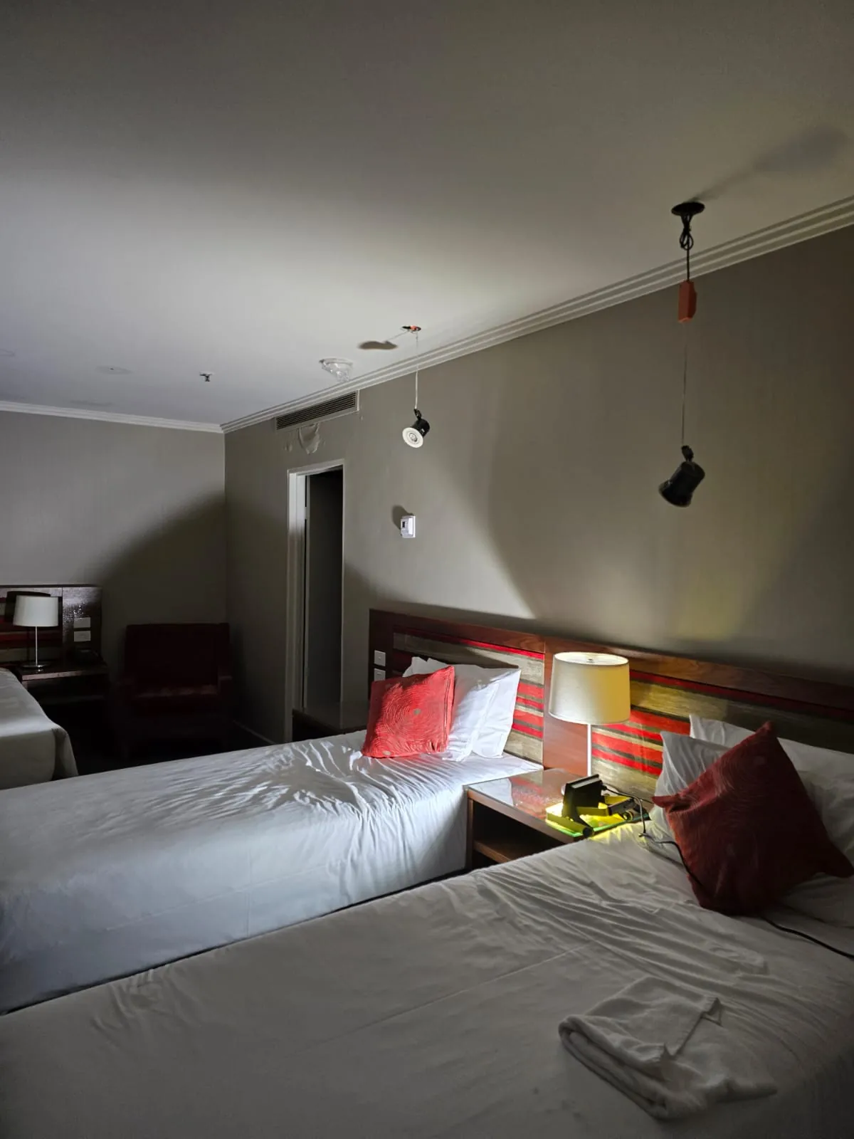 Towels laid across the bed in an affected guest room.