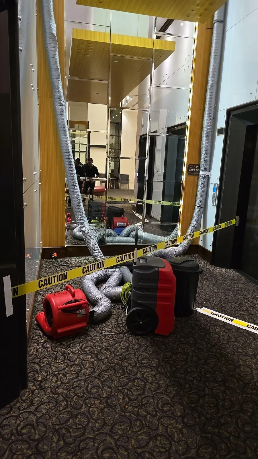 Drying set-up in the ground floor lobby, separated from guest traffic.