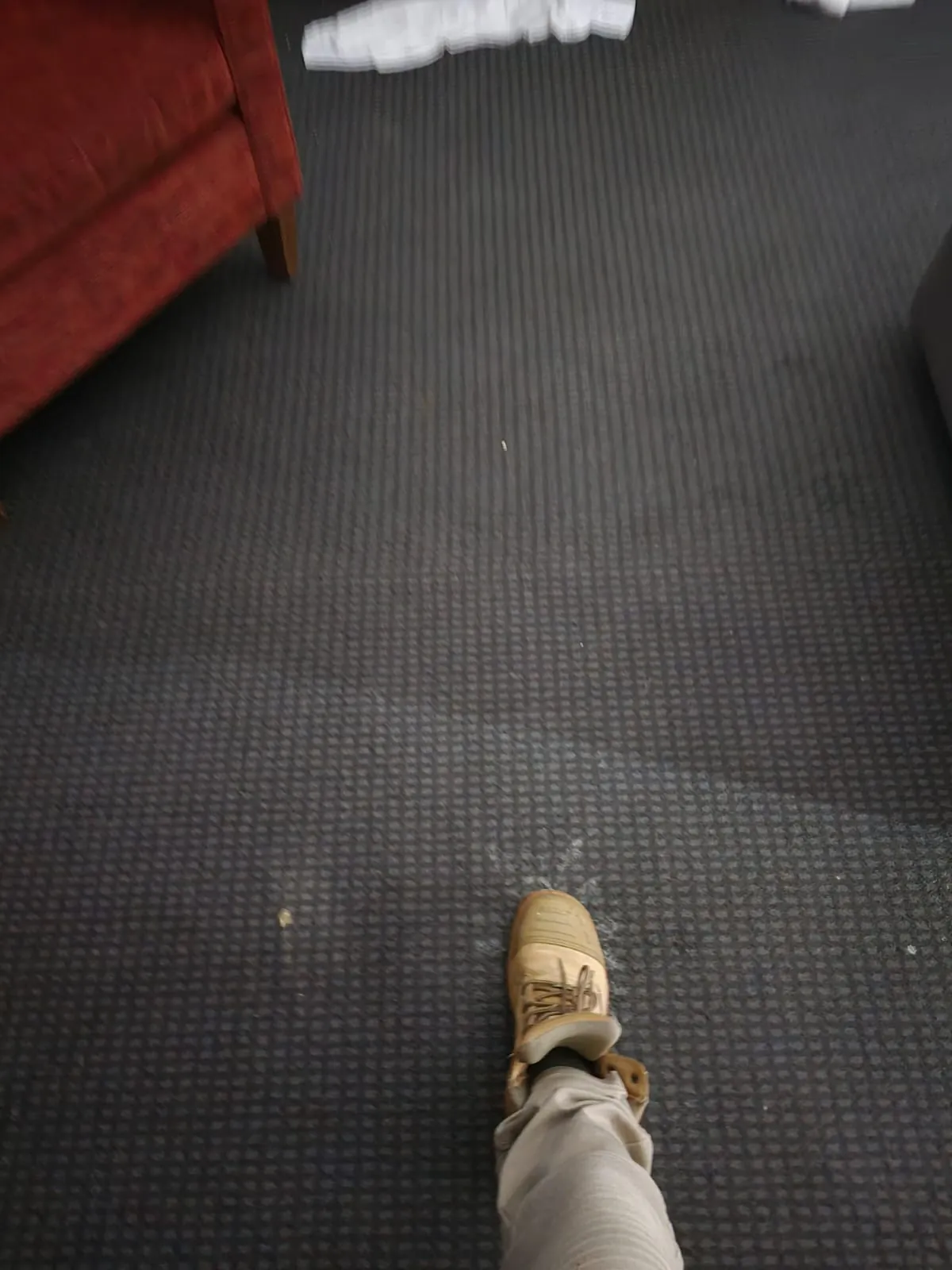 Checking saturated carpet underfoot.