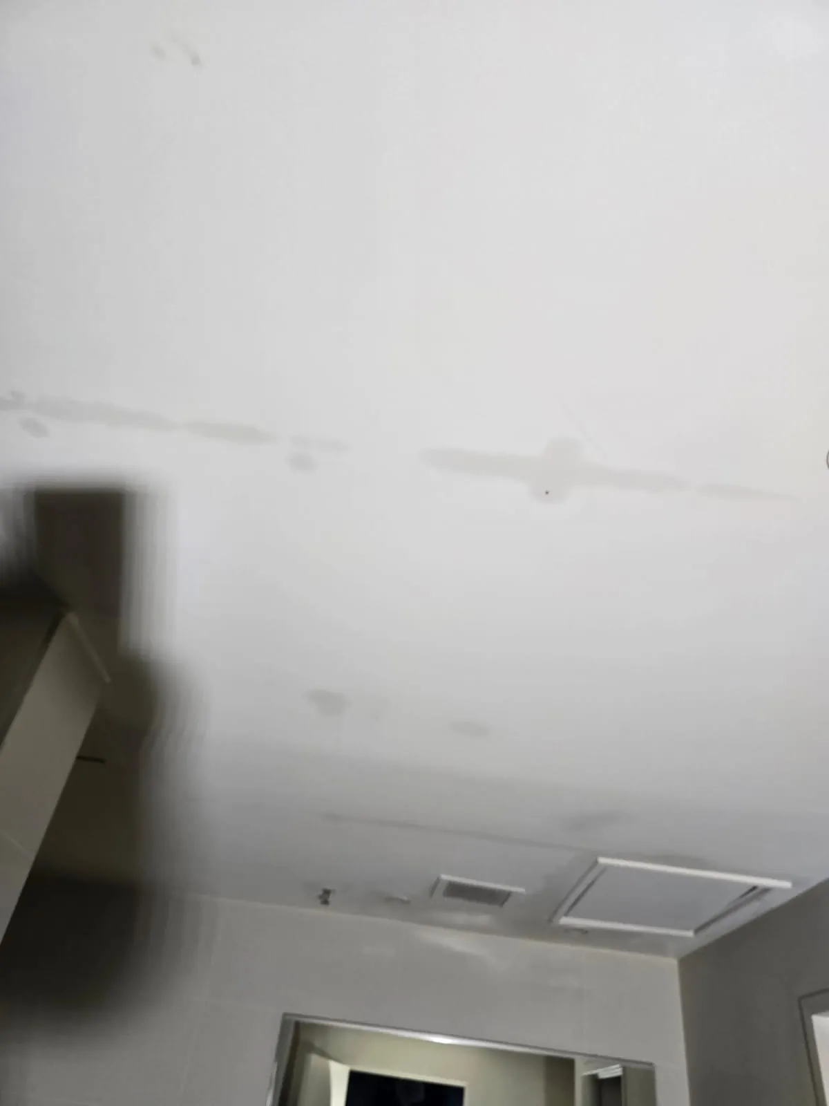 Water staining across a guest room ceiling.